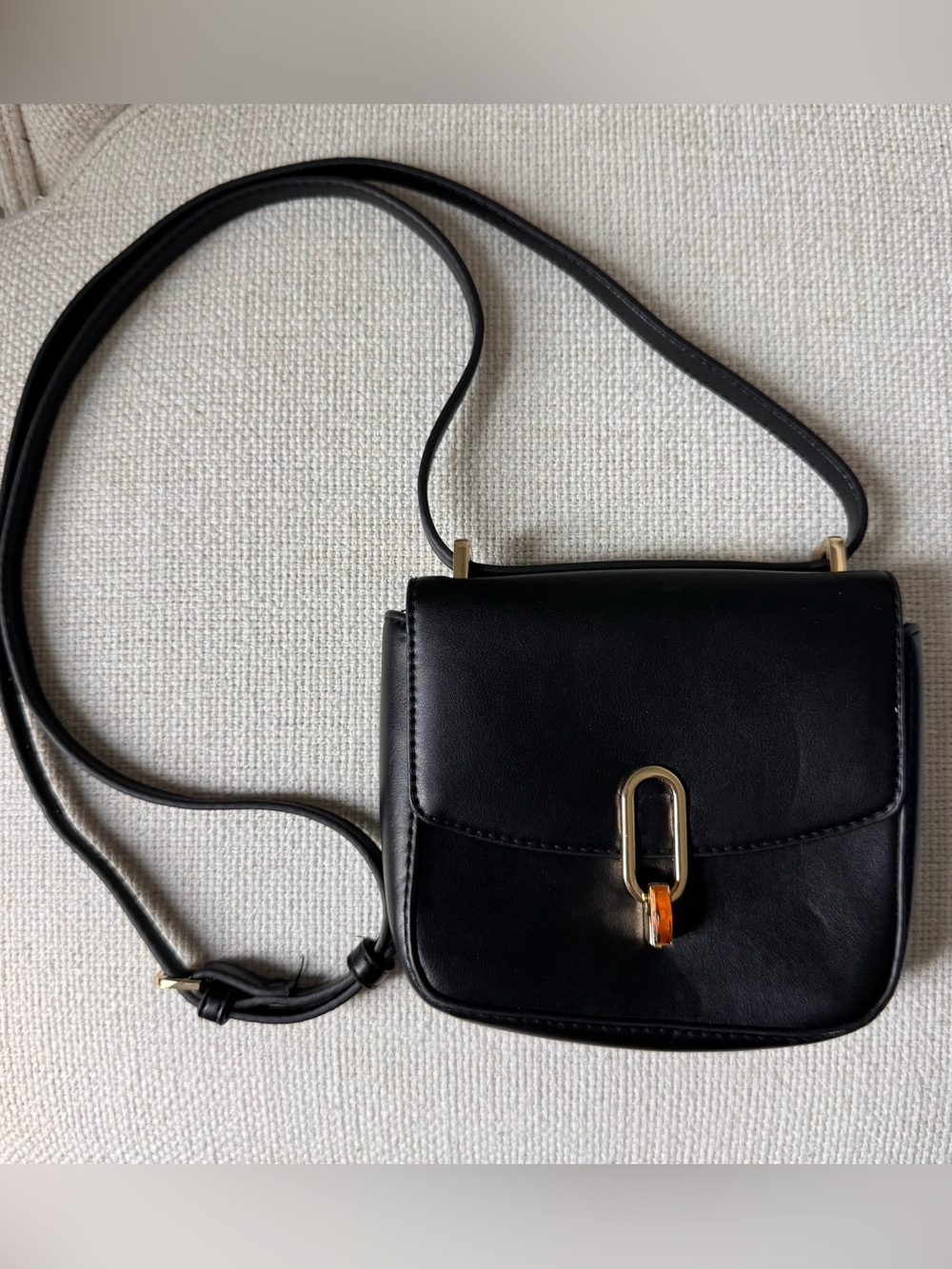 A New Day Classic Black Mini Crossbody Bag with Gold Hardware and Amber Accent